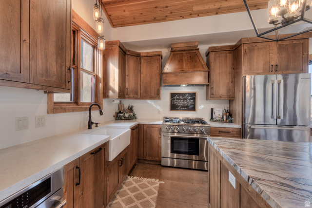 4173 Shadowfax Run, Unit 5 Moab, UT 84532 - Photo 19 of 41 Kitchen featuring stainless steel appliances, Knotty Alder cabinetry, Apron sink, wood ceiling, and light Quartz counters