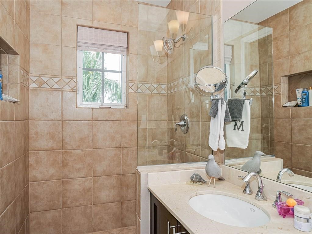 1564 Island Cove Road, Unit 1564 Fort Pierce, FL 34949 - Photo 17 of 26 a bathroom with a sink and a mirror