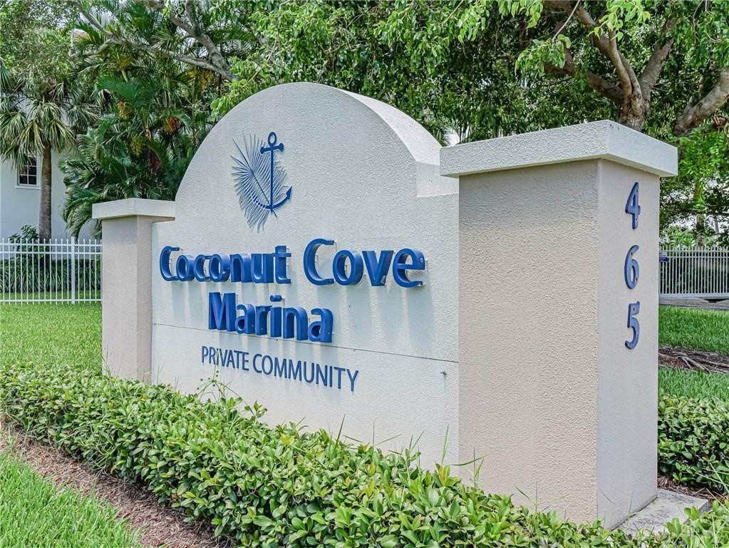 1564 Island Cove Road, Unit 1564 Fort Pierce, FL 34949 - Photo 19 of 26 a sign on the side of a building