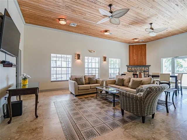 a view of a house with swimming pool and sitting area