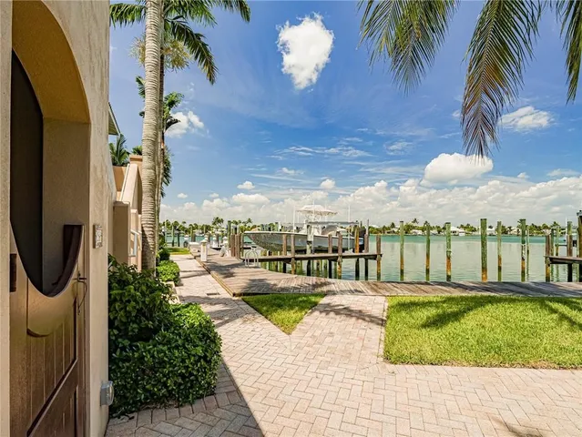 a view of a balcony with lake view and wooden floor