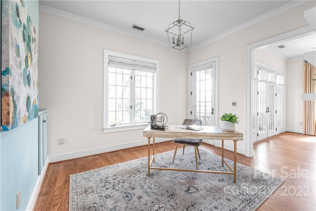 255 Queens Road, Unit 255 Charlotte, NC 28204 - Photo 20 of 32 a workspace with wooden floor and windows