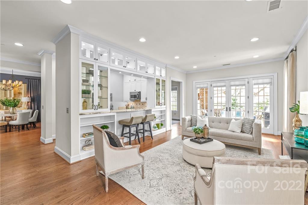 255 Queens Road, Unit 255 Charlotte, NC 28204 - Photo 2 of 32 a living room with furniture and a large window