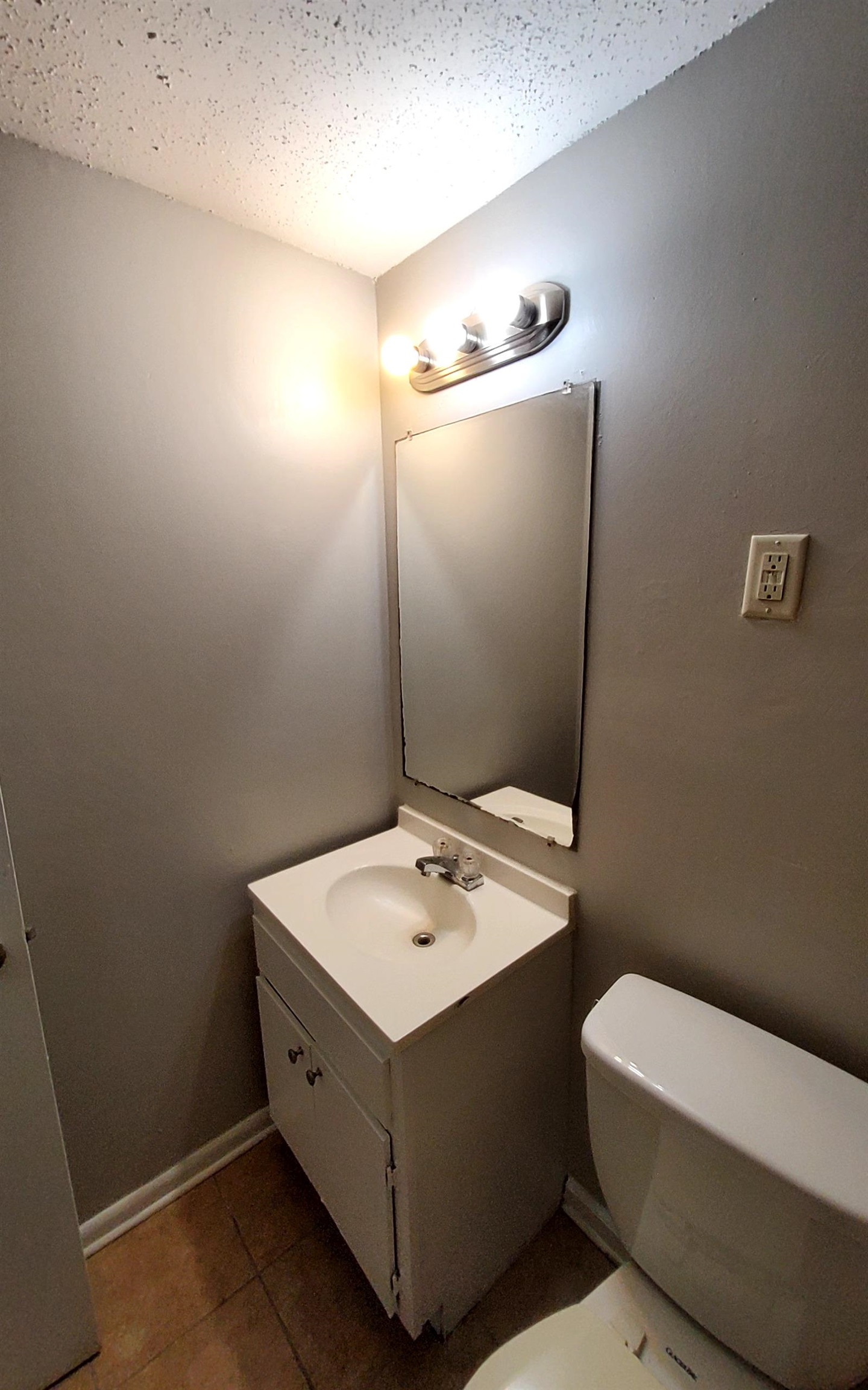 4227 Hobson Road Memphis, TN 38128 - Photo 8 of 12 a bathroom with a sink a toilet and mirror