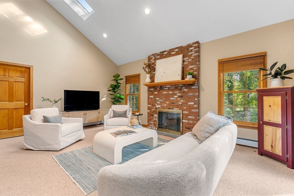 35 Lynn Road Needham, MA 02494 - Photo 13 of 38 a living room with fireplace furniture and a flat screen tv