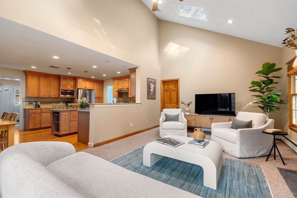 35 Lynn Road Needham, MA 02494 - Photo 15 of 38 a living room with furniture kitchen view and a wooden floor