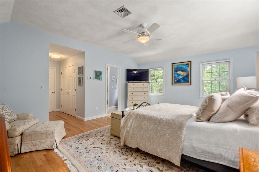 35 Lynn Road Needham, MA 02494 - Photo 18 of 38 a bedroom with a large bed and a couch