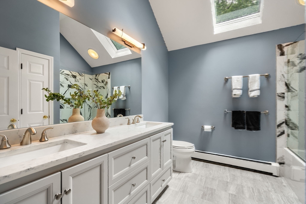 35 Lynn Road Needham, MA 02494 - Photo 24 of 38 a bathroom with a granite countertop sink and a mirror
