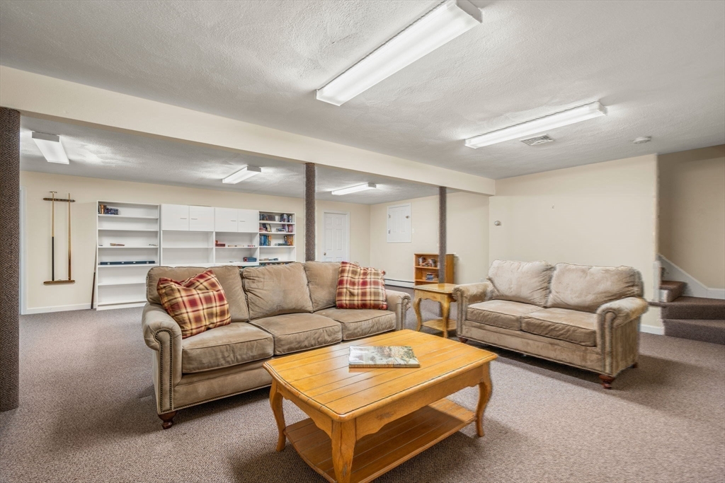 35 Lynn Road Needham, MA 02494 - Photo 31 of 38 a living room with furniture and a couch