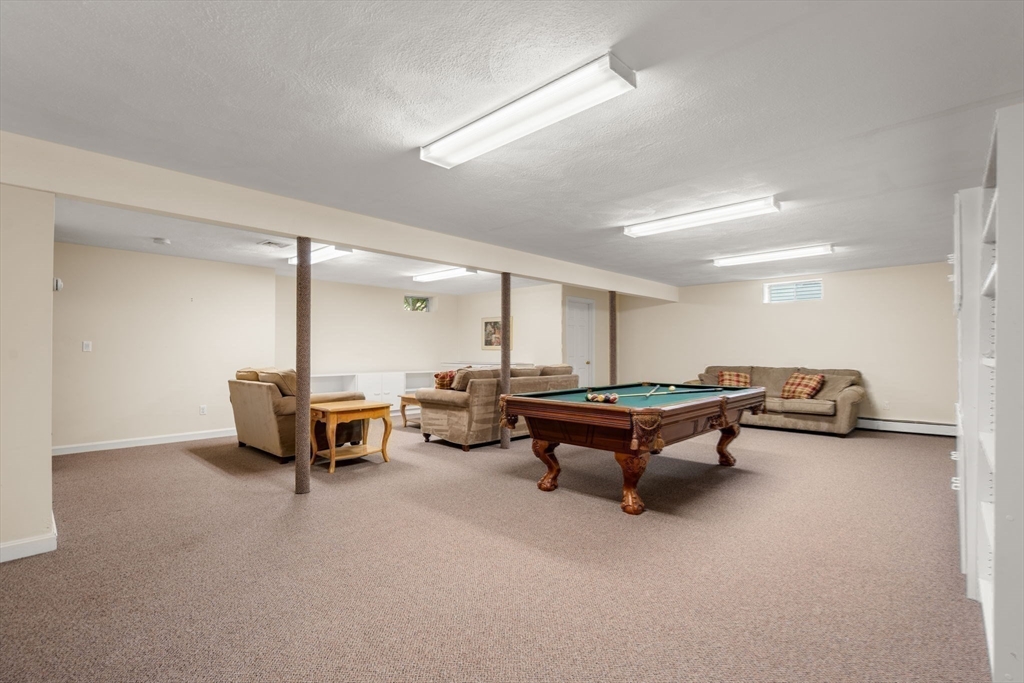 35 Lynn Road Needham, MA 02494 - Photo 33 of 38 a living room with furniture and a table