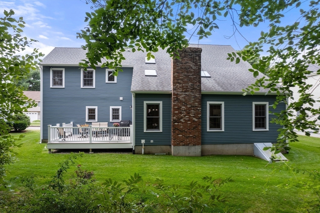 35 Lynn Road Needham, MA 02494 - Photo 36 of 38 front view of a house with a yard
