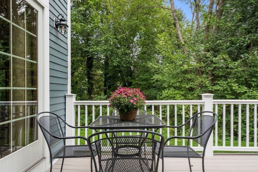 35 Lynn Road Needham, MA 02494 - Photo 4 of 38 a view of a chair and table in the balcony