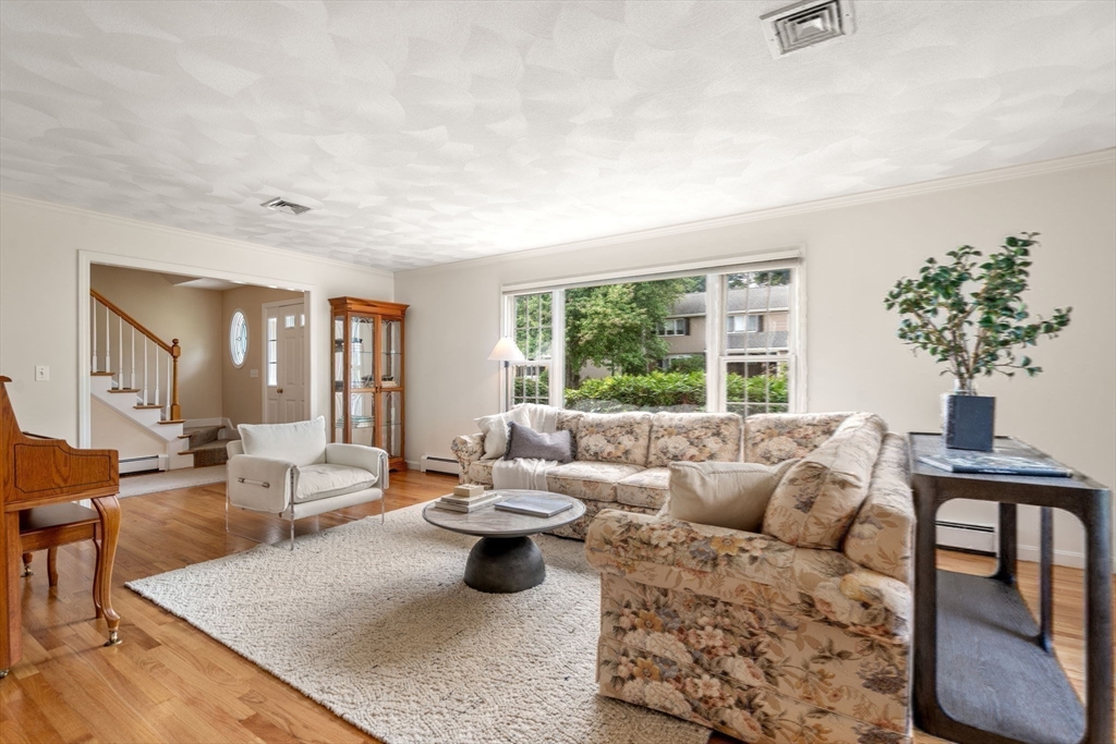 35 Lynn Road Needham, MA 02494 - Photo 6 of 38 a living room with furniture and a large window