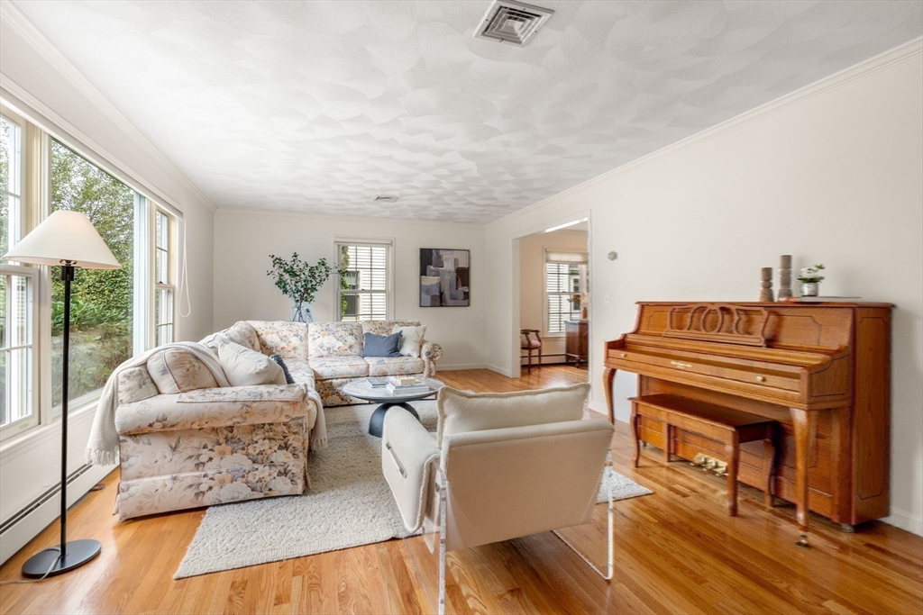 35 Lynn Road Needham, MA 02494 - Photo 7 of 38 a living room with furniture and a flat screen tv
