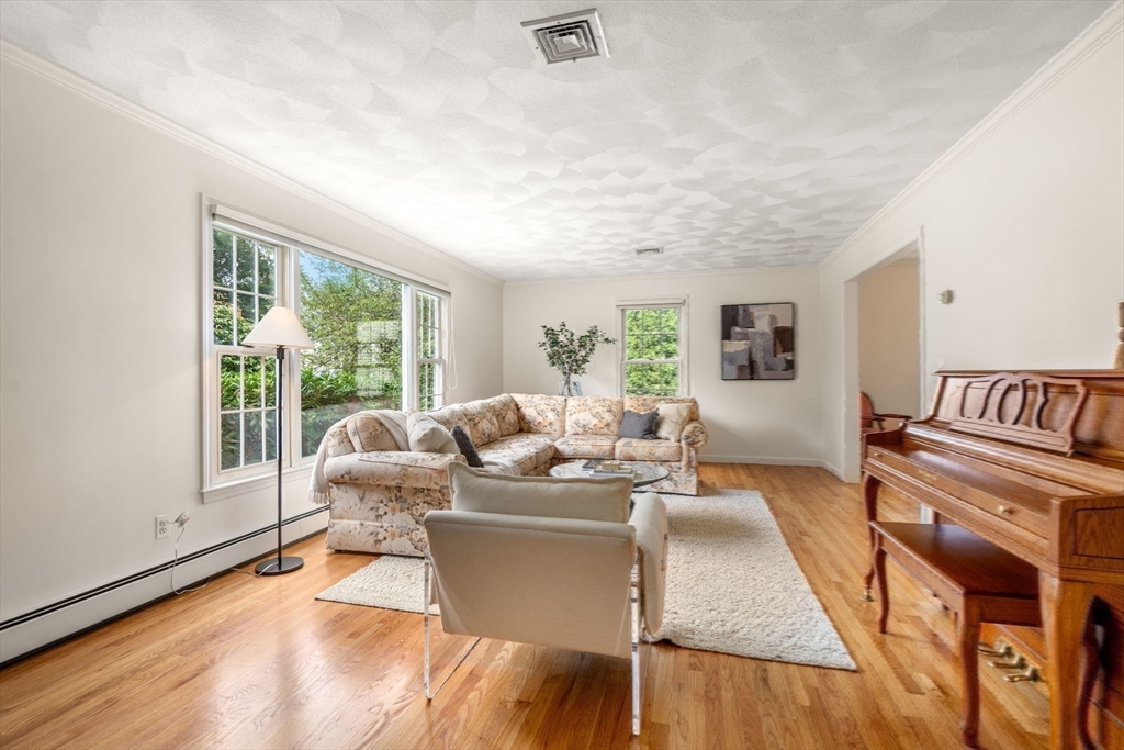 35 Lynn Road Needham, MA 02494 - Photo 8 of 38 a living room with furniture and a large window