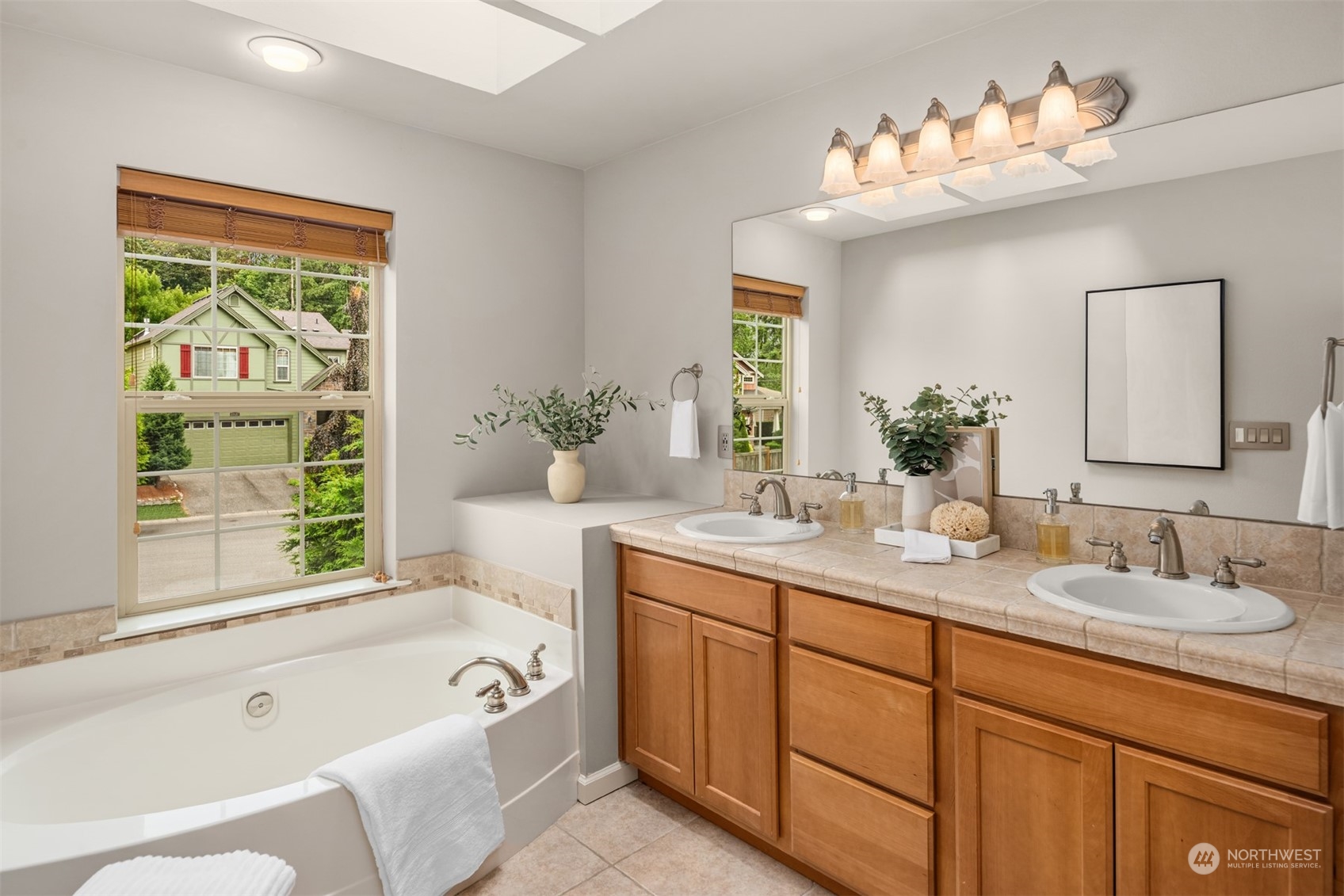 23116 87th Avenue West Edmonds, WA 98026 - Photo 14 of 27 a bathroom with a tub sink and mirror