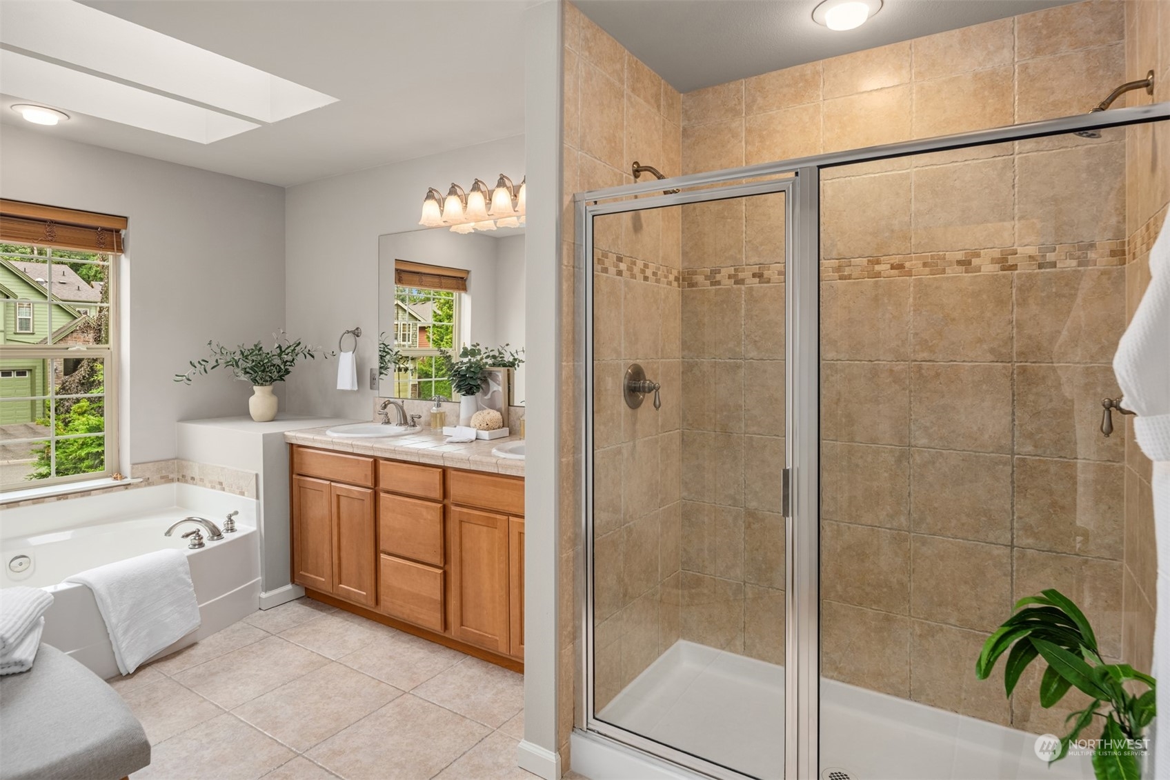 23116 87th Avenue West Edmonds, WA 98026 - Photo 15 of 27 a bathroom with a granite countertop tub a shower and a sink
