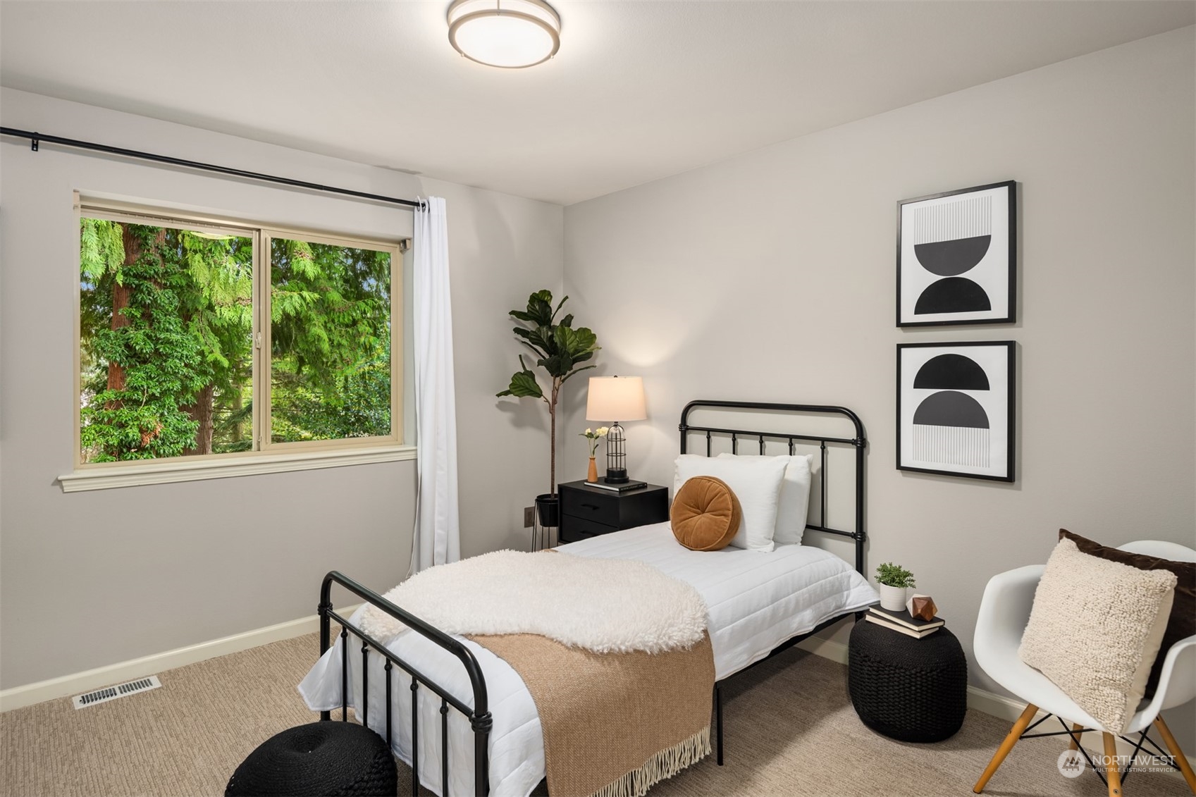 23116 87th Avenue West Edmonds, WA 98026 - Photo 19 of 27 a bedroom with a bed a window and potted plant on the table