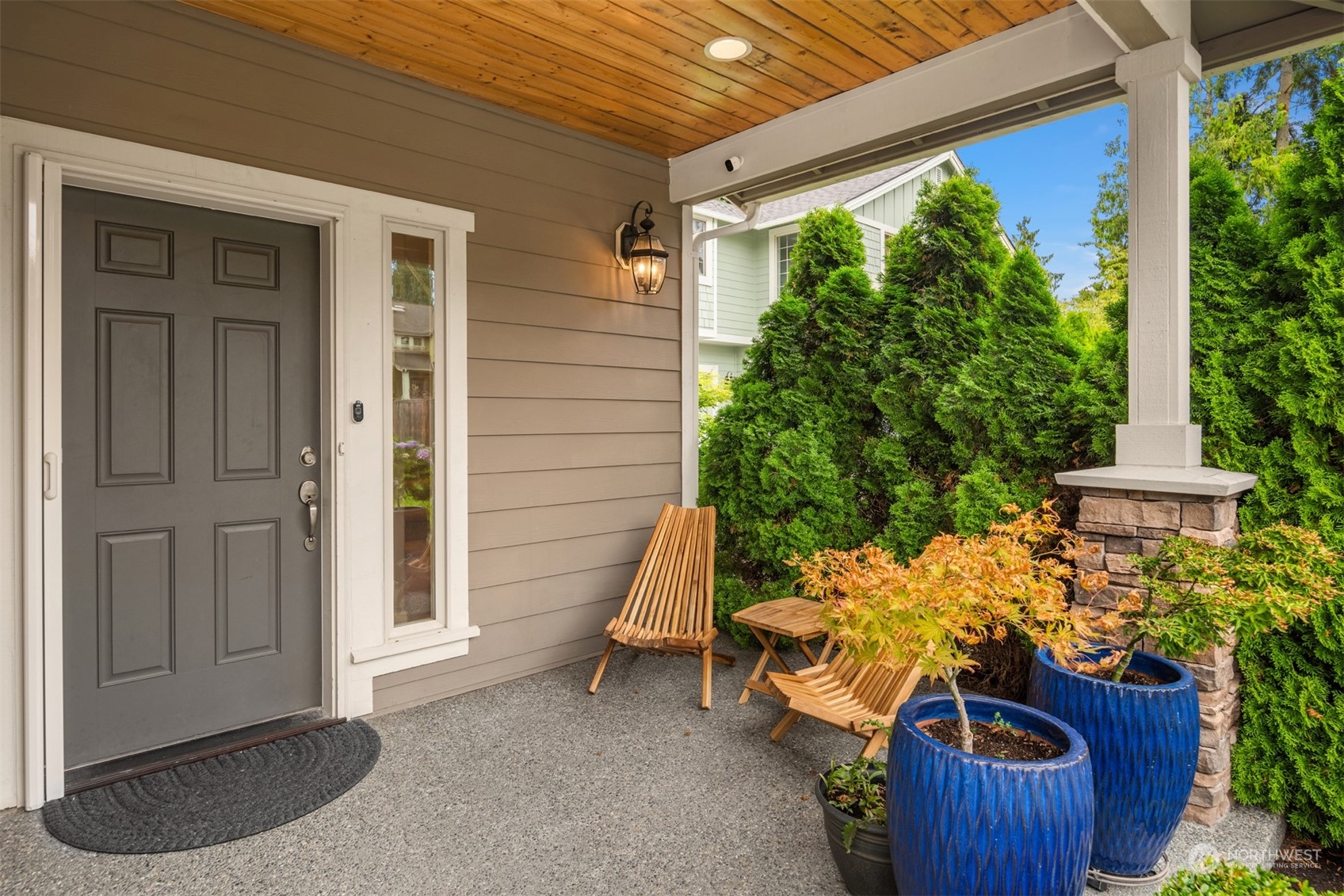 23116 87th Avenue West Edmonds, WA 98026 - Photo 2 of 27 a view of a porch with furniture and a yard