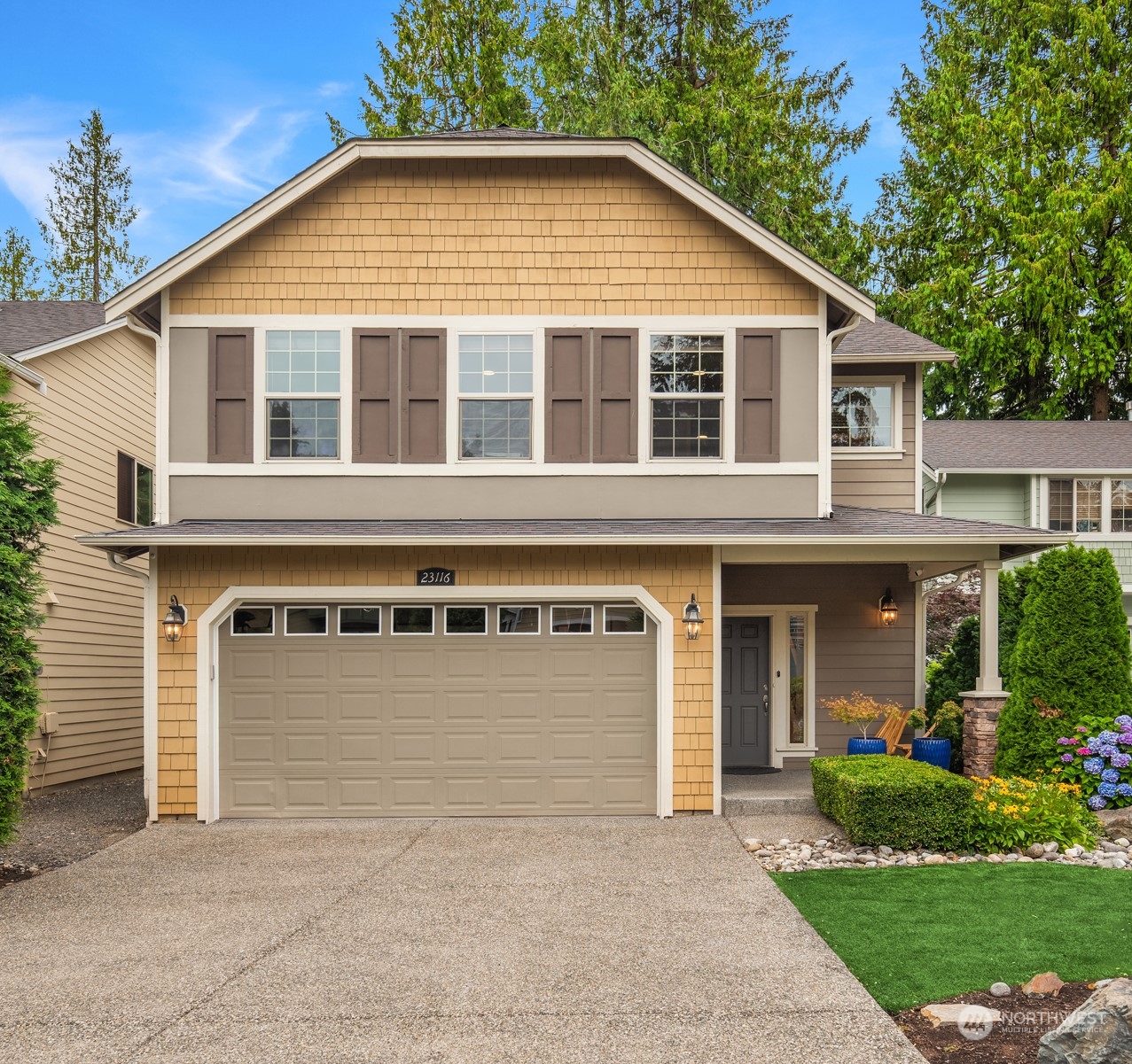 23116 87th Avenue West Edmonds, WA 98026 - Photo 27 of 27 a front view of a house with a yard and garage