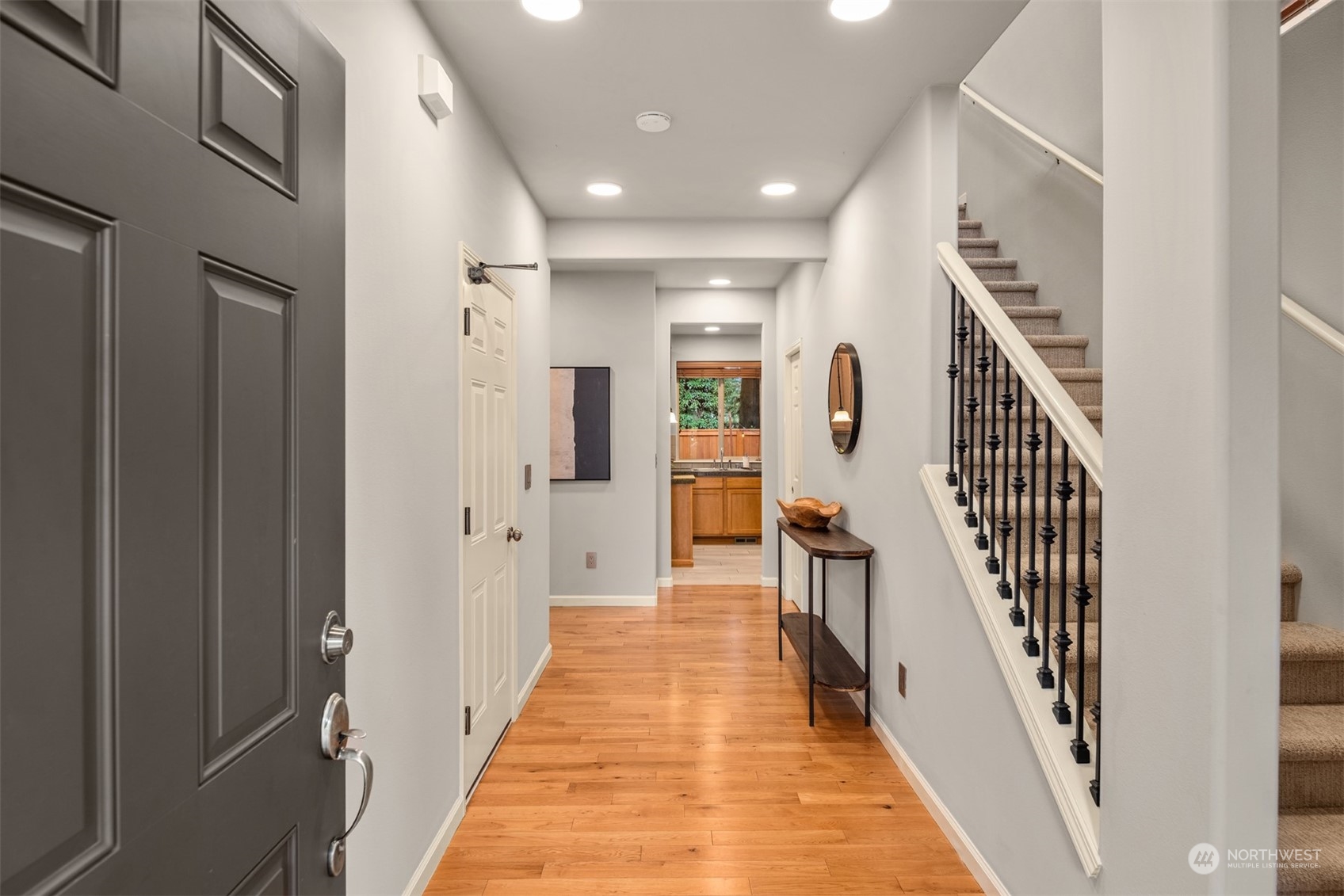 23116 87th Avenue West Edmonds, WA 98026 - Photo 3 of 27 a view of a hallway with wooden floor and stairs
