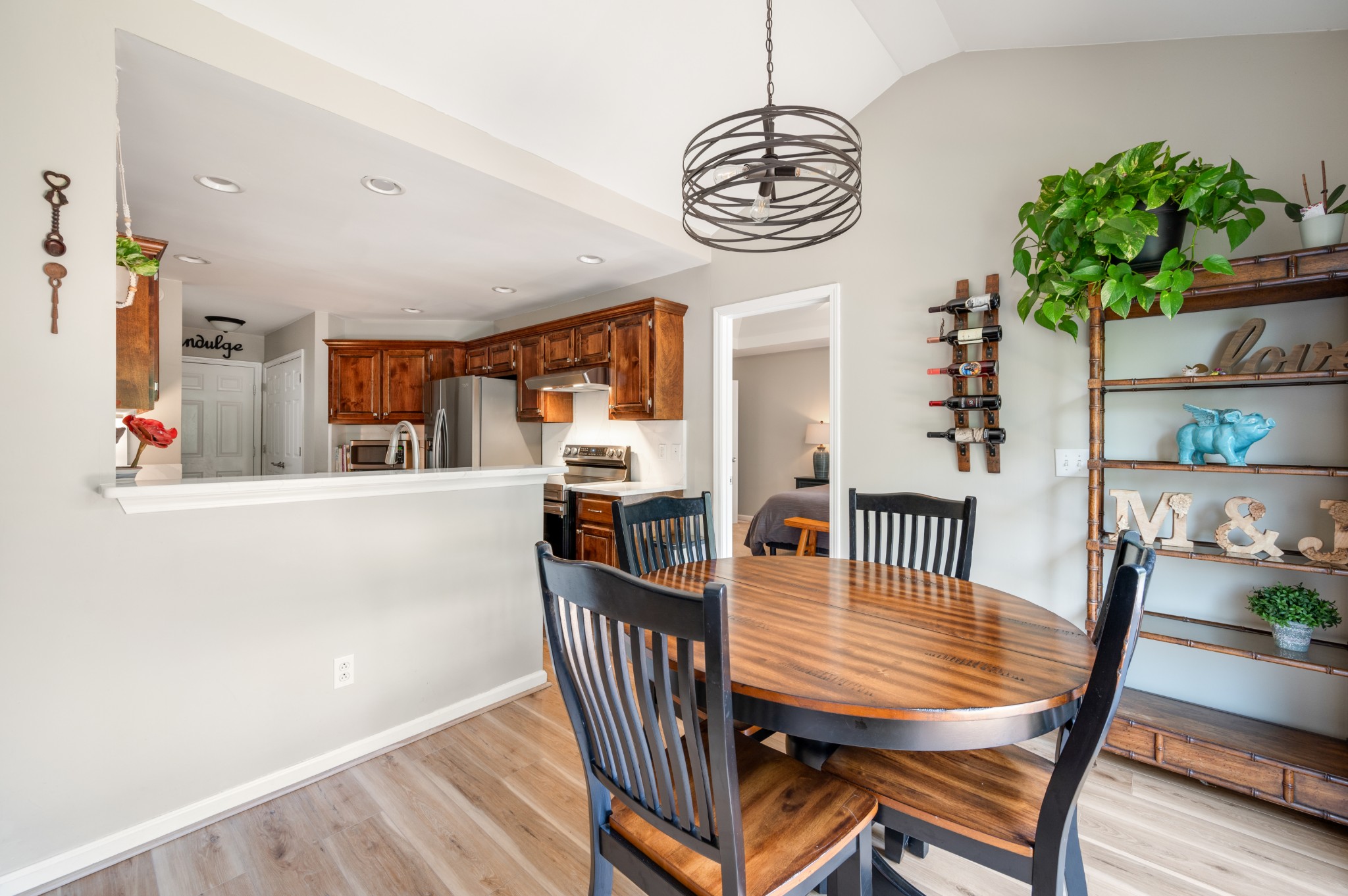 546 Windy Road Mount Juliet, TN 37122 - Photo 13 of 49 a view of a dining room with furniture a chandelier and wooden floor