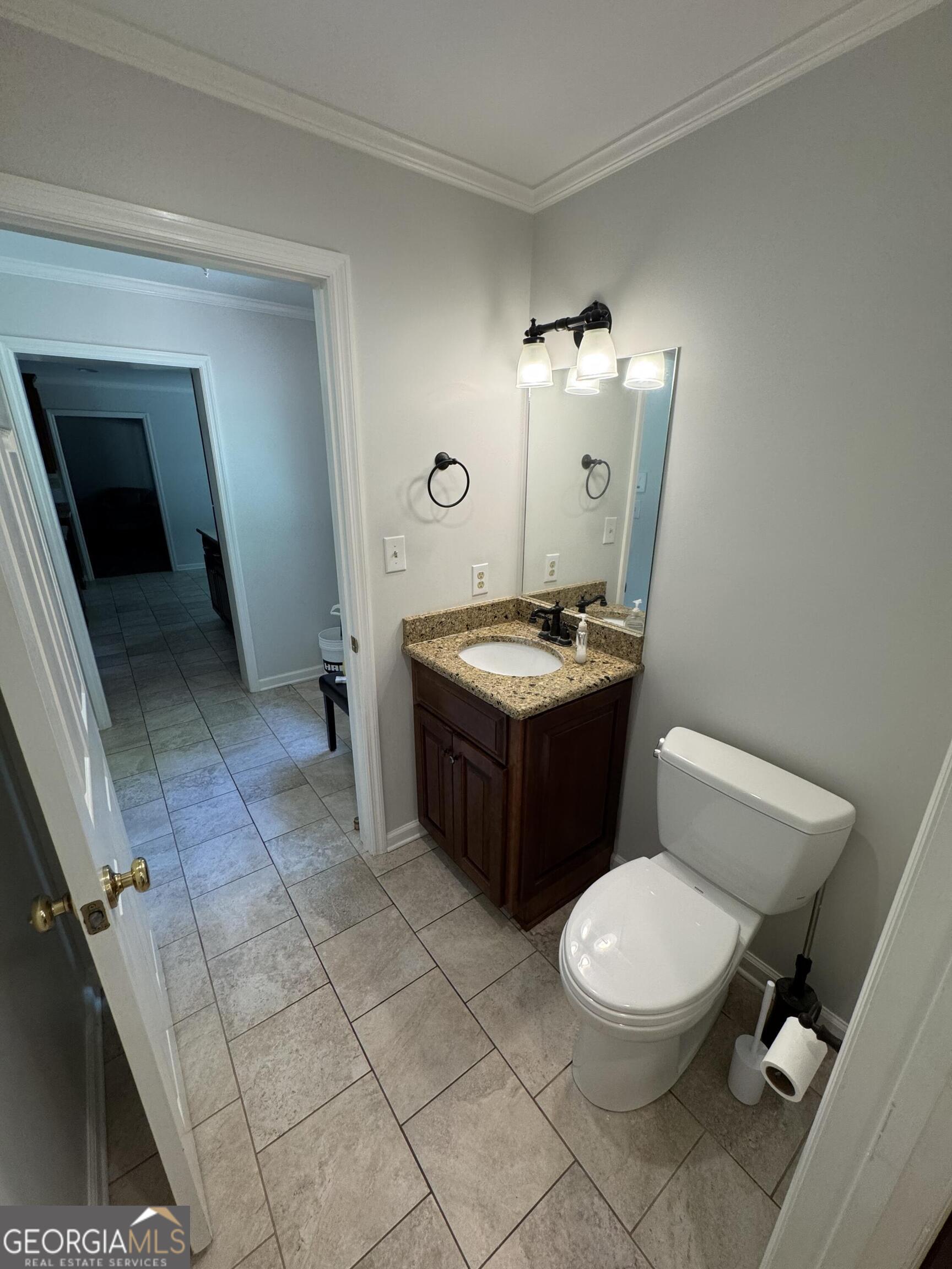 355 Summer Hill Road Thomasville, GA 31757 - Photo 16 of 50 a bathroom with a toilet sink and mirror