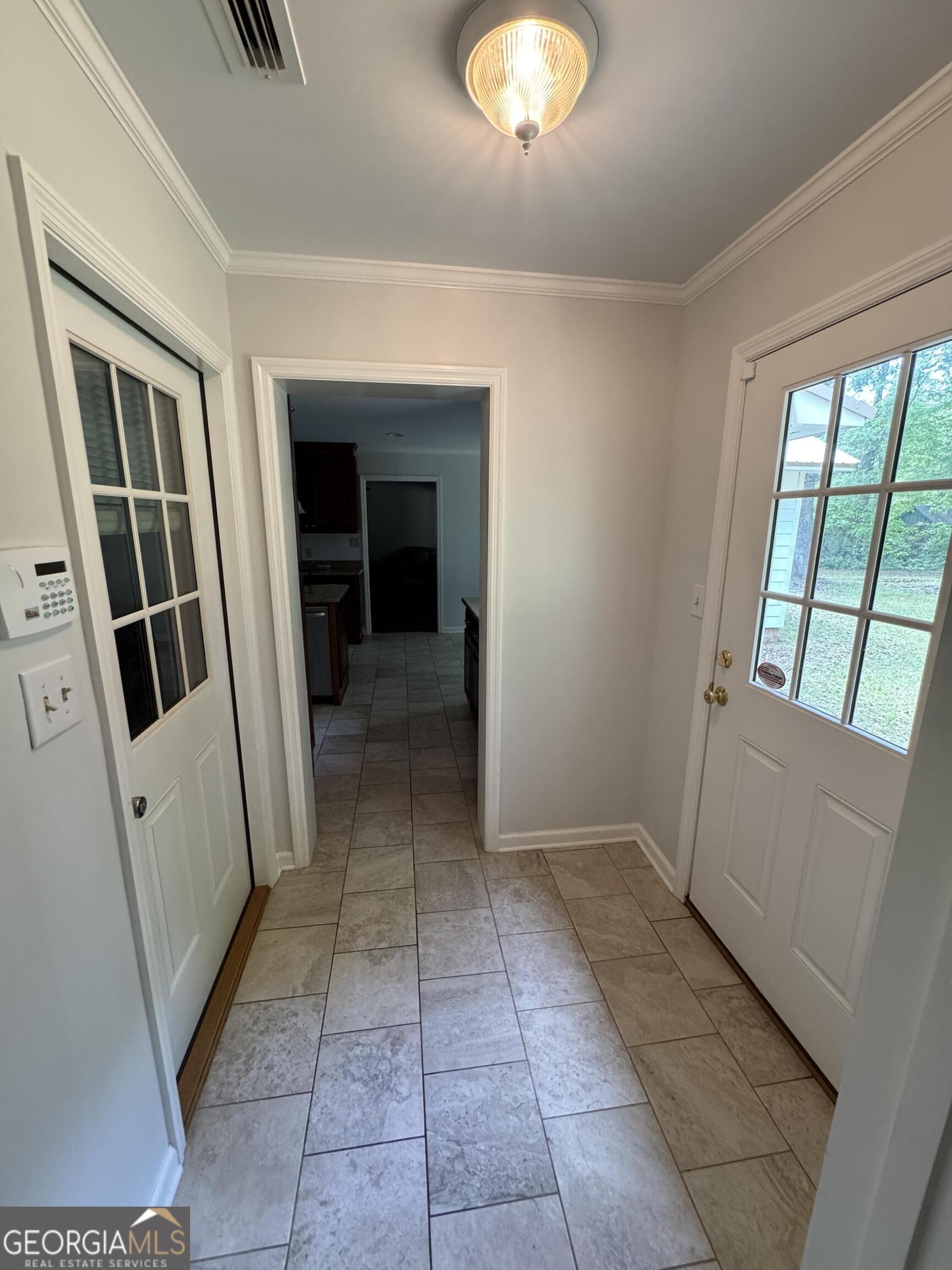 355 Summer Hill Road Thomasville, GA 31757 - Photo 17 of 50 a view of a hallway to rooms and stairs