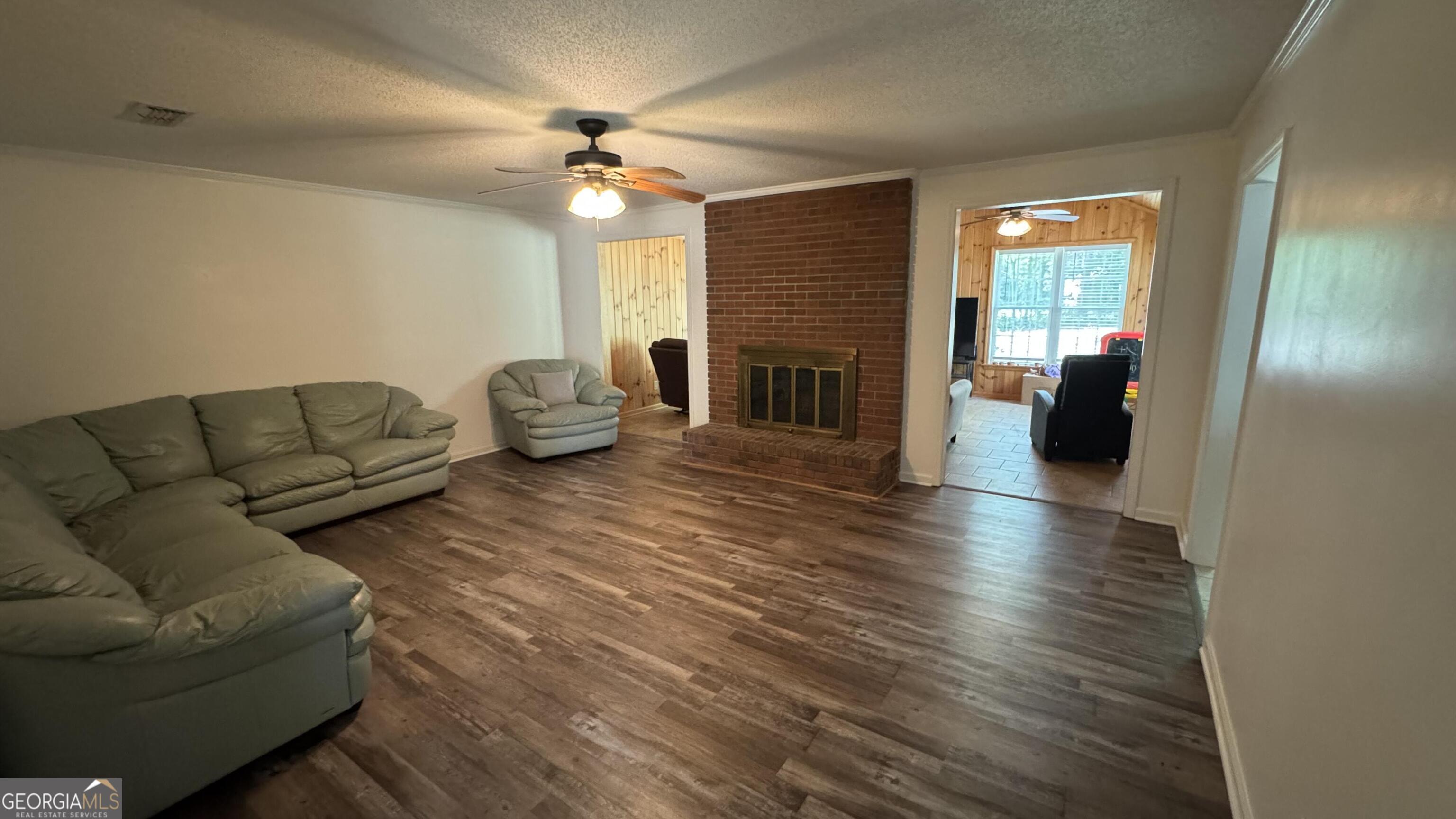 355 Summer Hill Road Thomasville, GA 31757 - Photo 26 of 50 a living room with furniture and a fireplace
