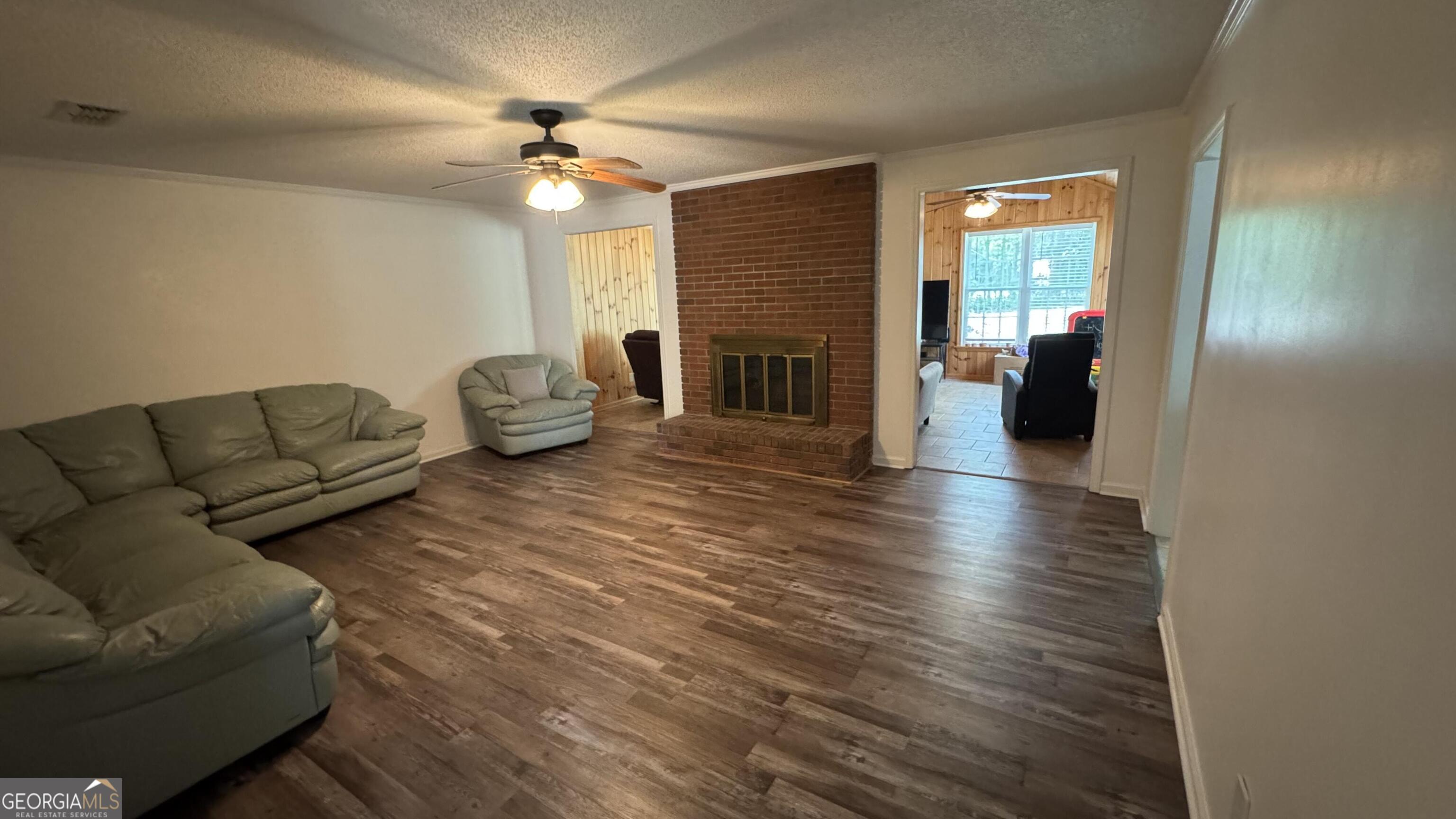 355 Summer Hill Road Thomasville, GA 31757 - Photo 27 of 50 a living room with furniture and a fireplace