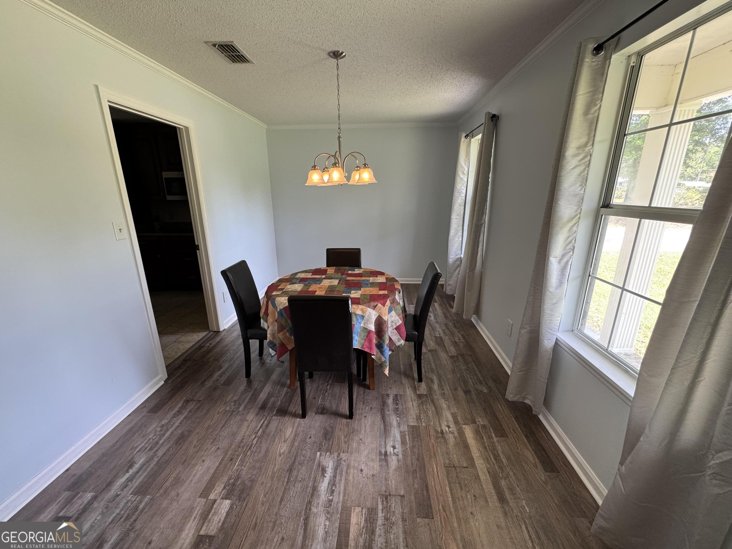 355 Summer Hill Road Thomasville, GA 31757 - Photo 28 of 50 a view of a dining room with furniture window and wooden floor