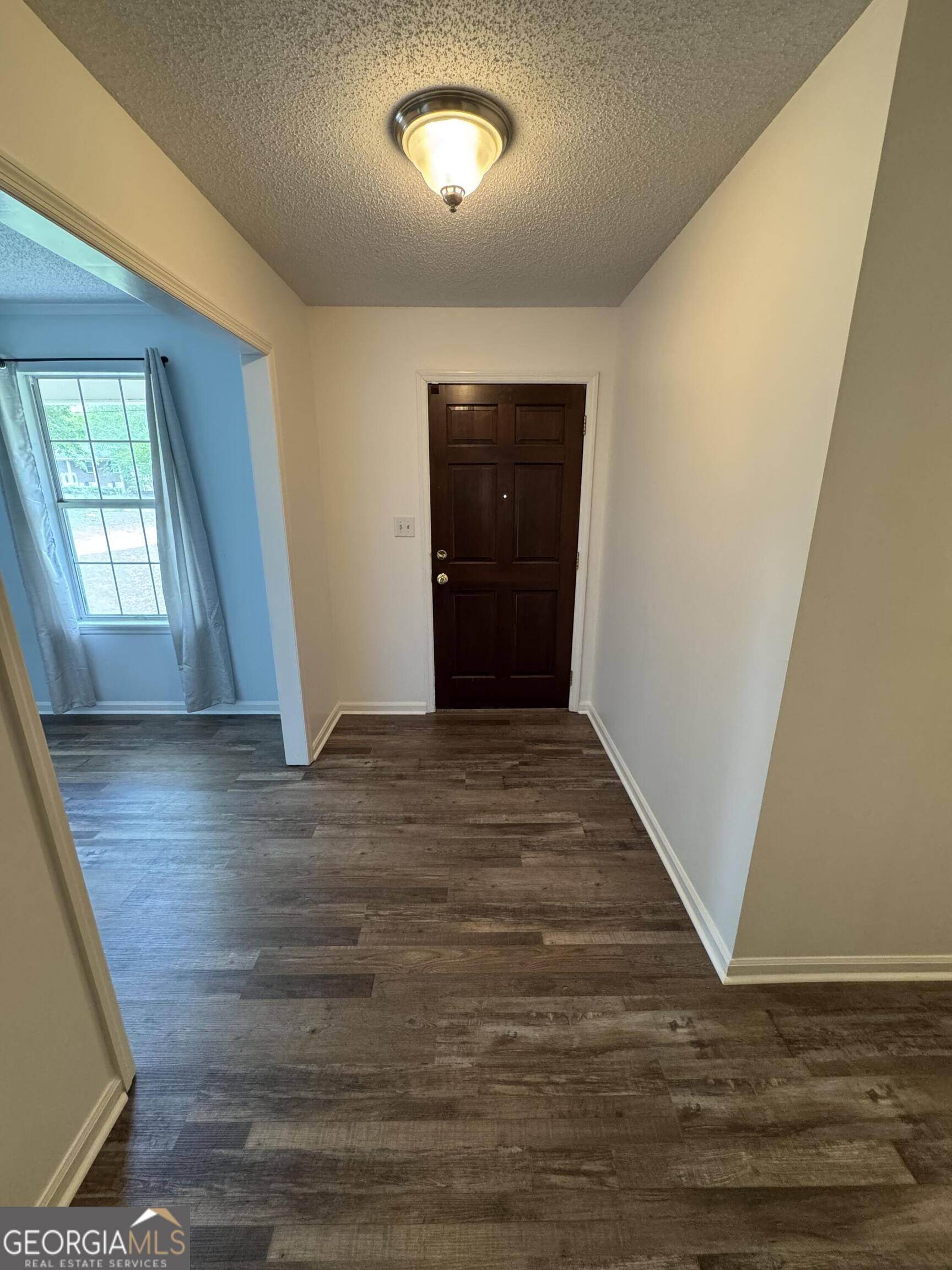 355 Summer Hill Road Thomasville, GA 31757 - Photo 31 of 50 wooden floor in an empty room with a window