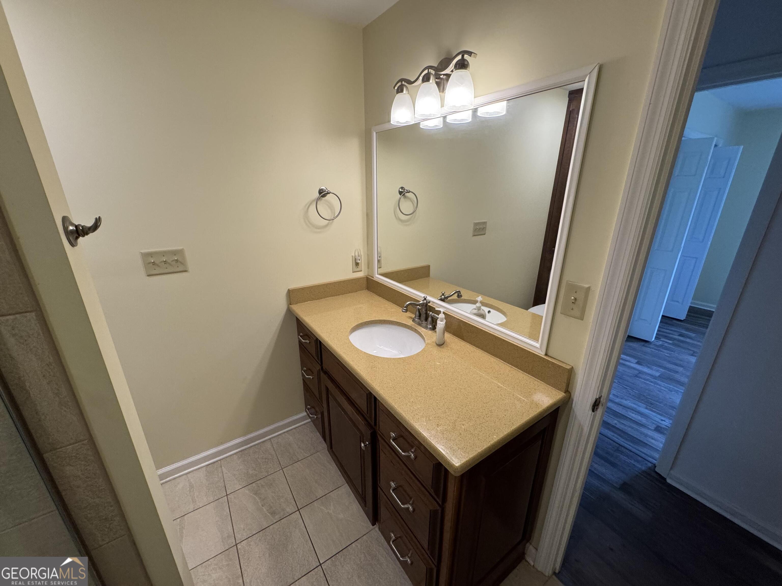 355 Summer Hill Road Thomasville, GA 31757 - Photo 37 of 50 a bathroom with a sink a mirror and vanity