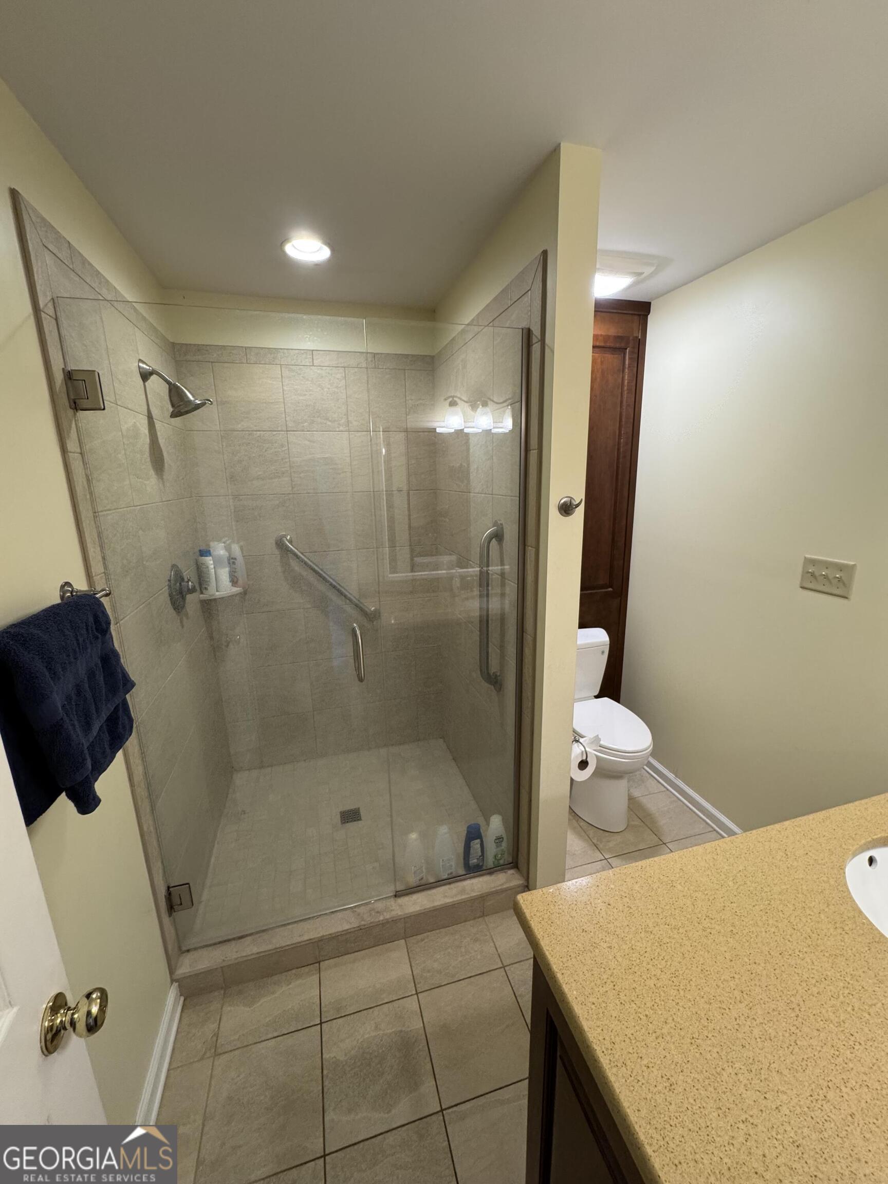 355 Summer Hill Road Thomasville, GA 31757 - Photo 38 of 50 a bathroom with a sink and shower