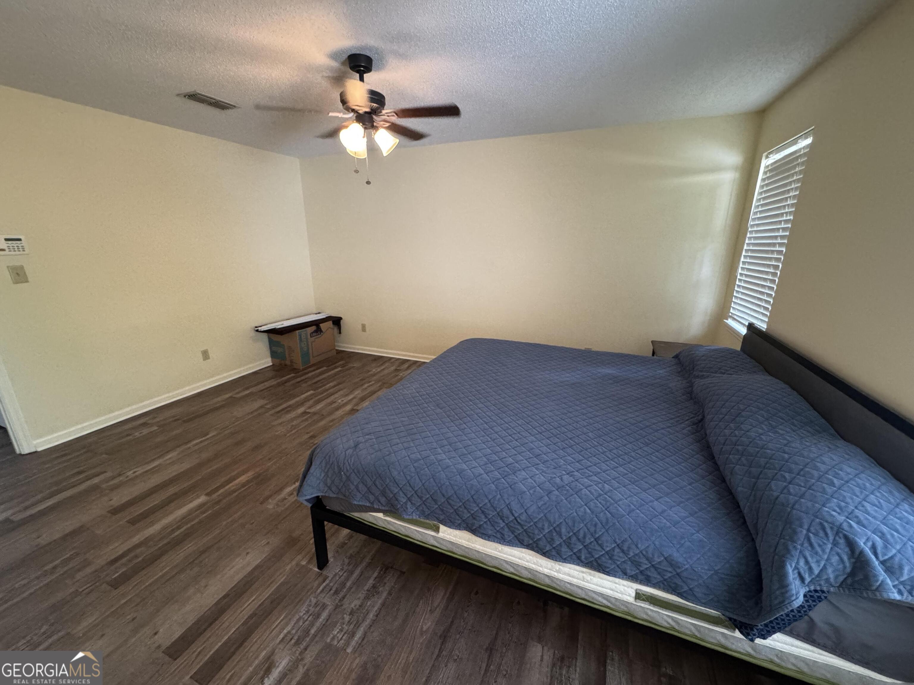 355 Summer Hill Road Thomasville, GA 31757 - Photo 41 of 50 a bed sitting in a room next to a window