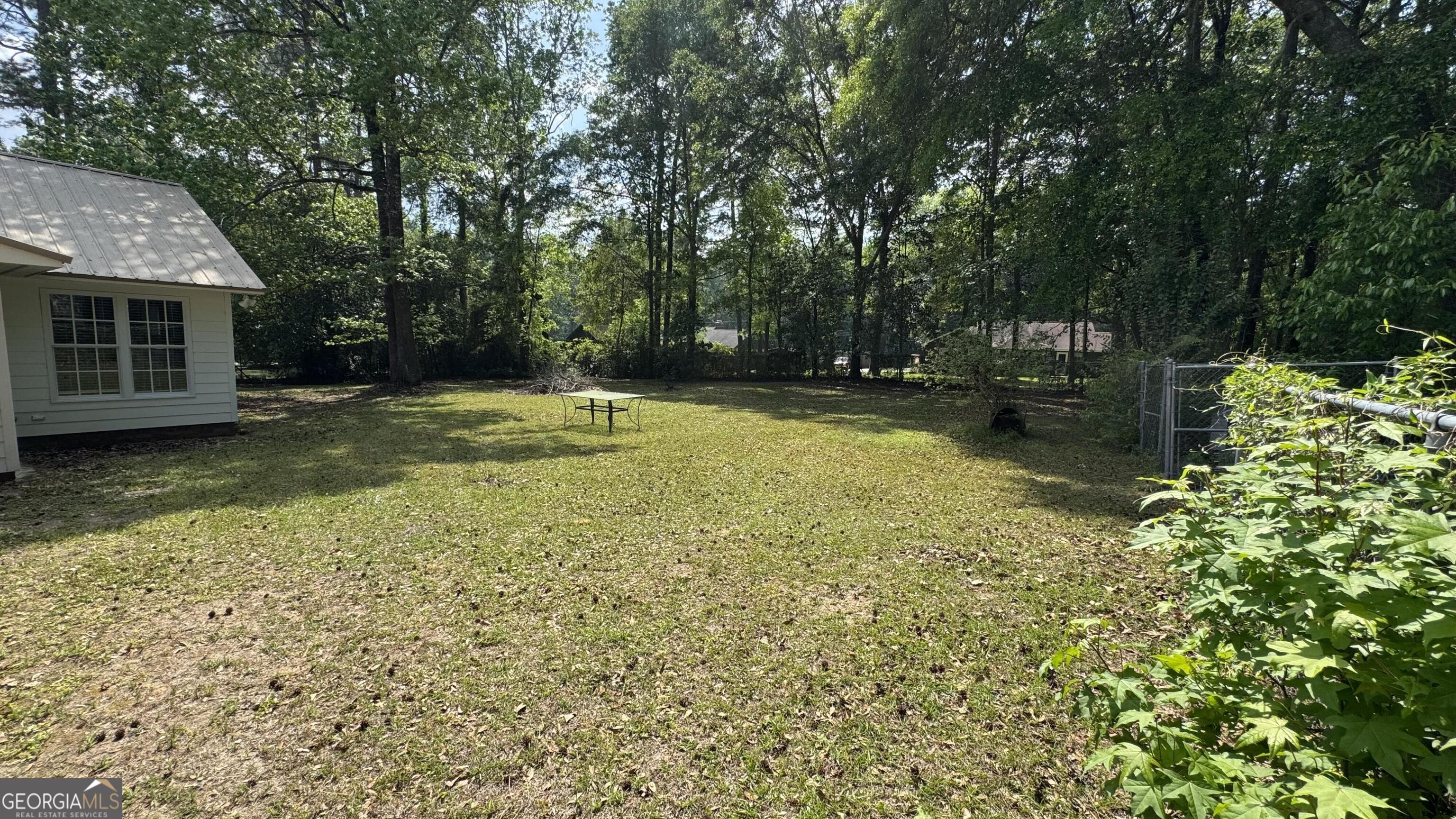 355 Summer Hill Road Thomasville, GA 31757 - Photo 5 of 50 a view of a house with swimming pool next to a yard
