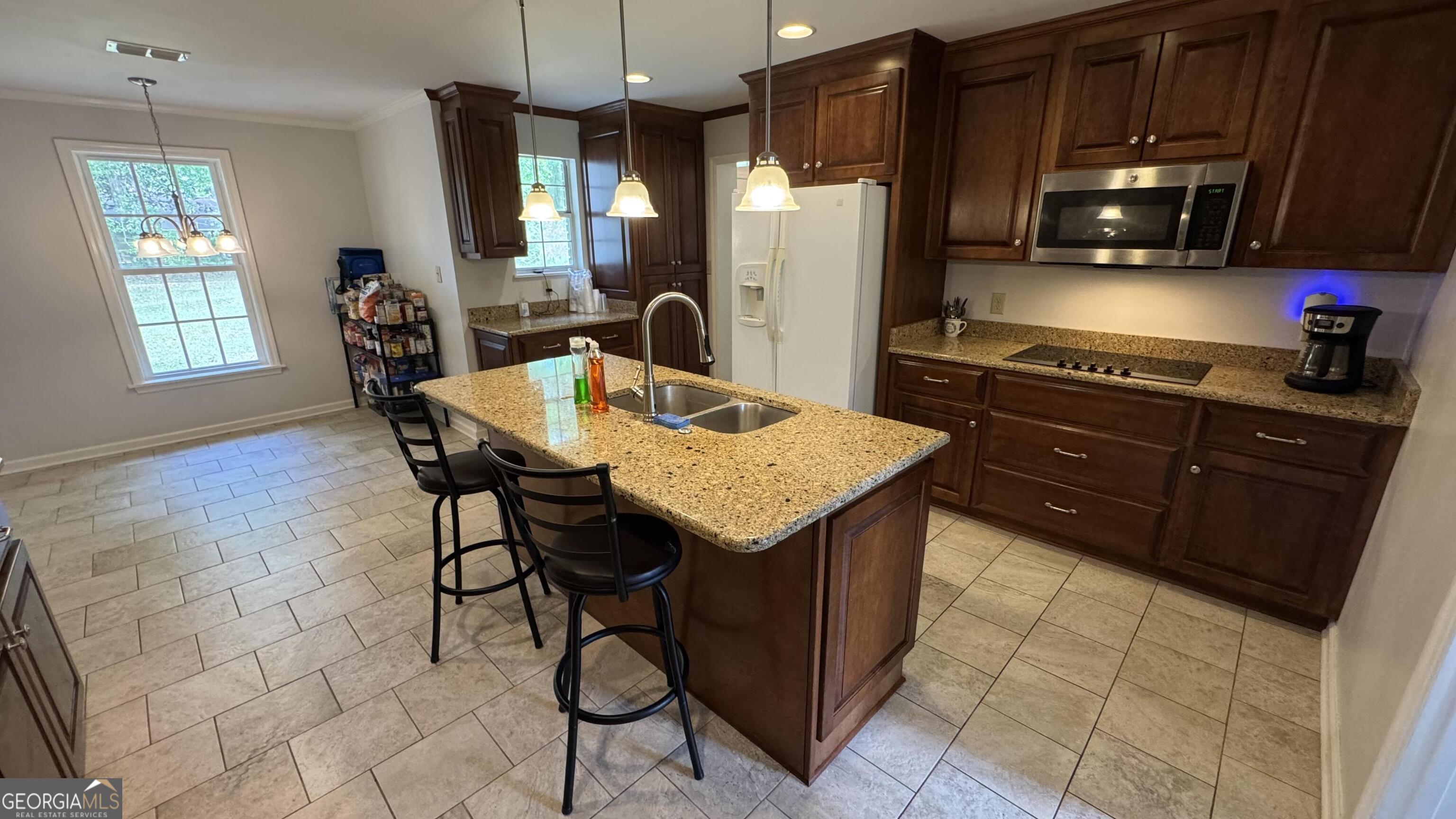 355 Summer Hill Road Thomasville, GA 31757 - Photo 9 of 50 a kitchen with a sink cabinets and appliances