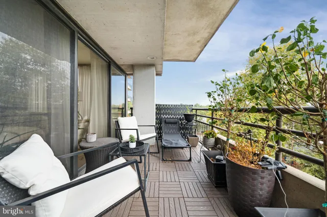 swimming pool view with a seating space
