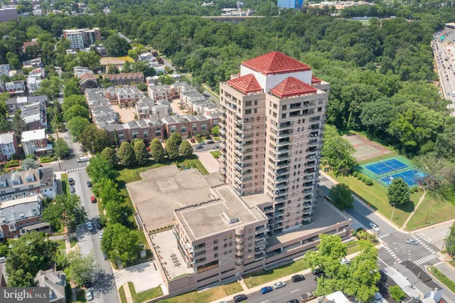 an aerial view of multiple houses with yard