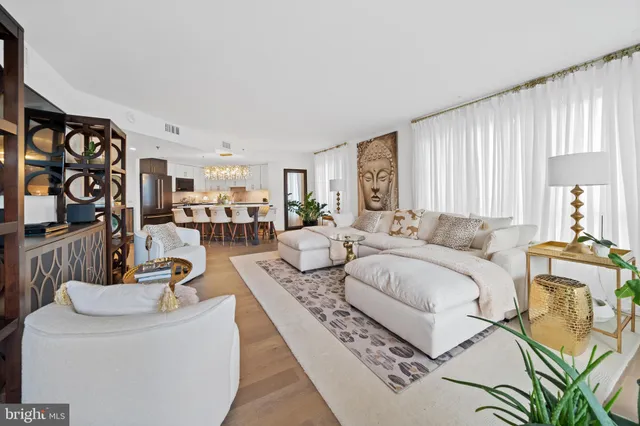 a living room with furniture and a table