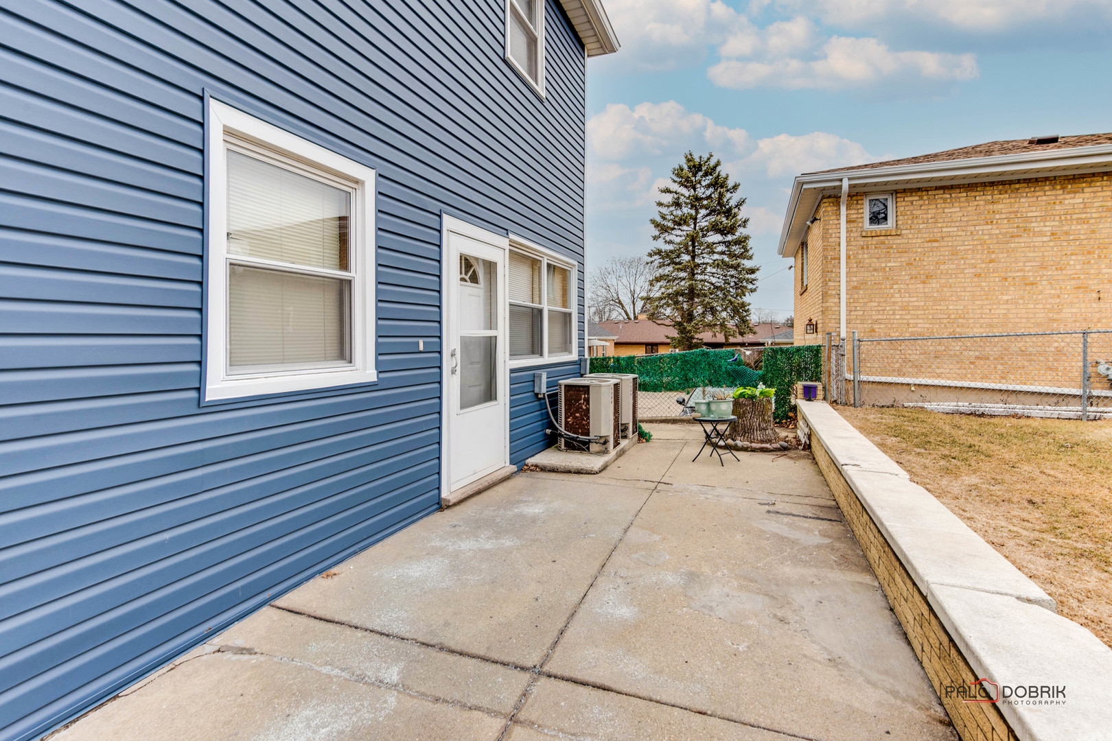 47 Prairie Avenue, Unit 1 Highwood, IL 60040 - Photo 18 of 20 a view of a patio with a table and chairs and potted plants