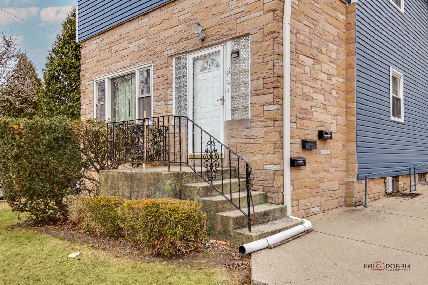 47 Prairie Avenue, Unit 1 Highwood, IL 60040 - Photo 2 of 20 a view of a balcony with two chairs and a table