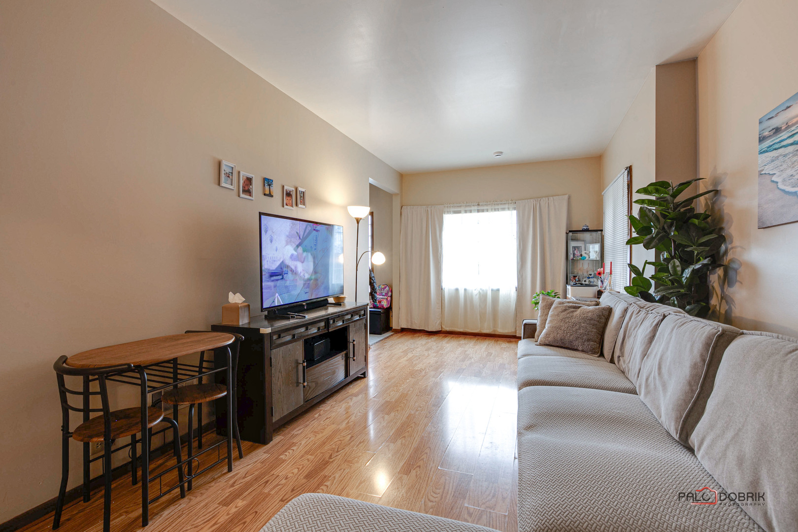47 Prairie Avenue, Unit 1 Highwood, IL 60040 - Photo 5 of 20 a living room with furniture and a flat screen tv