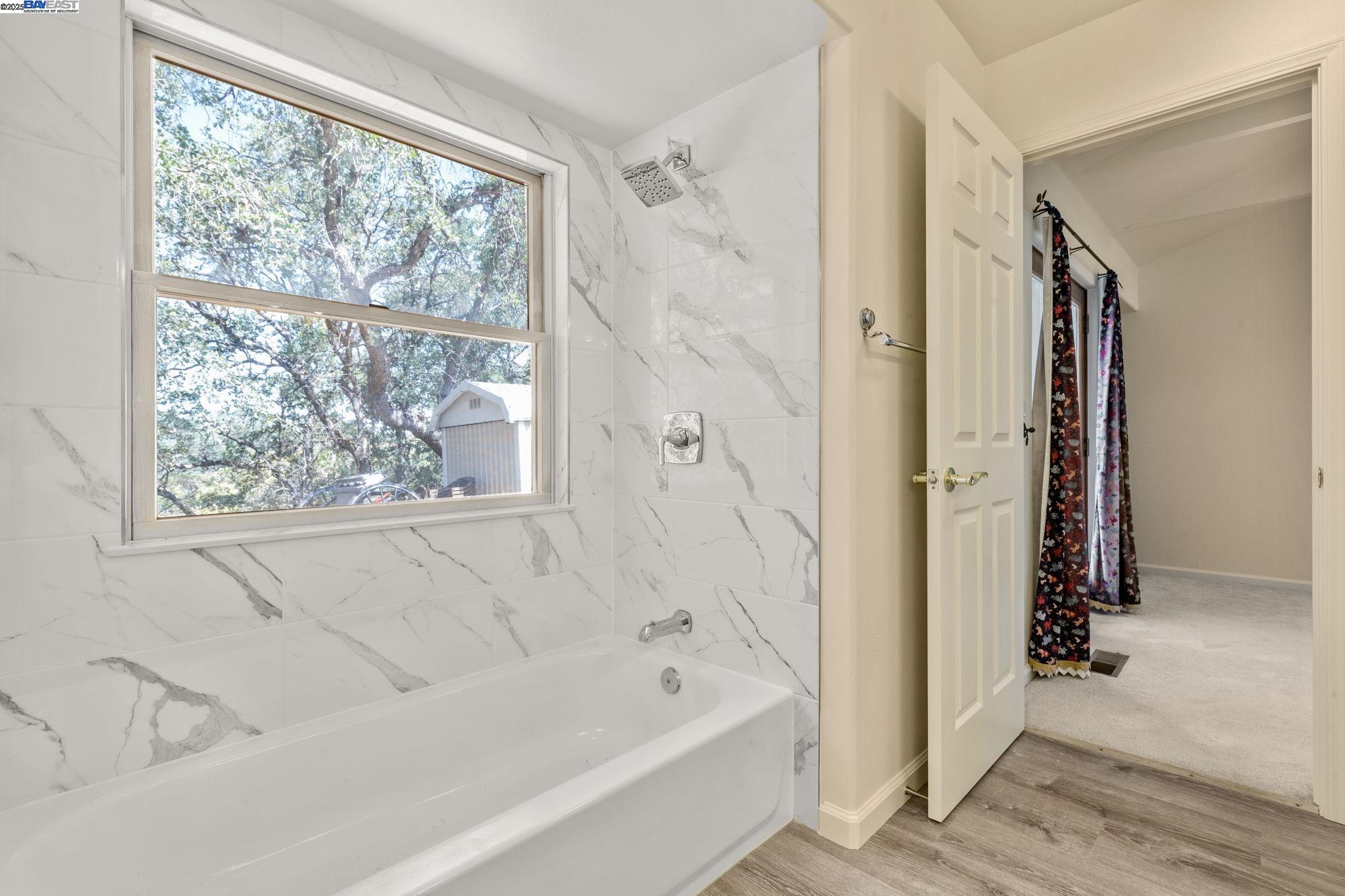 59480 Mines Road Livermore, CA 94550 - Photo 36 of 44 Downstairs bath, tub/shower combination, tile and window