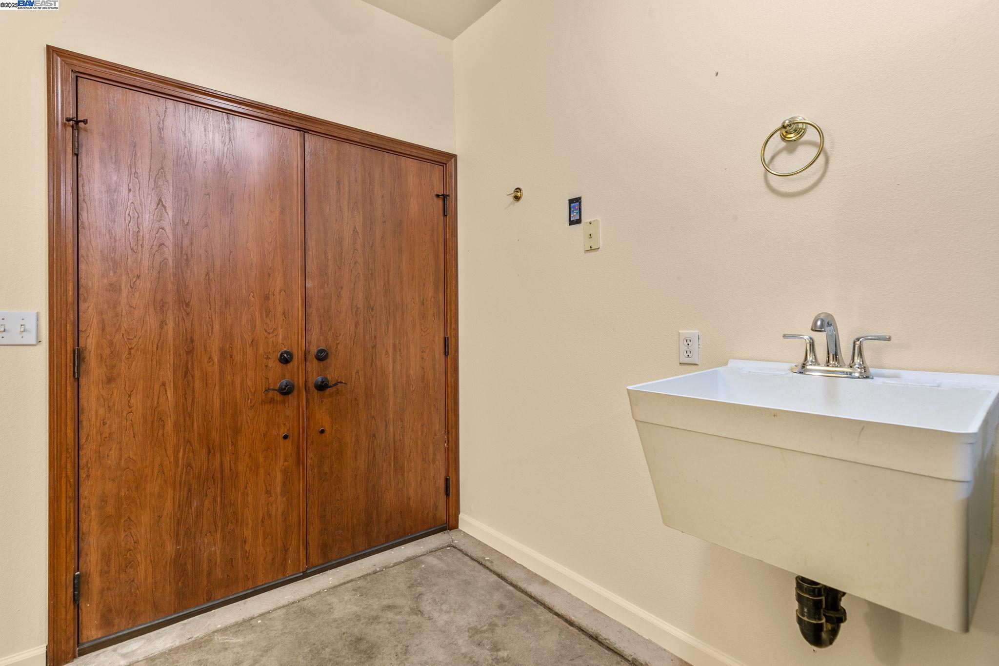 59480 Mines Road Livermore, CA 94550 - Photo 39 of 44 Pantry/ mudroom double-door entry, sink, part of mudroom/pantry/laundry