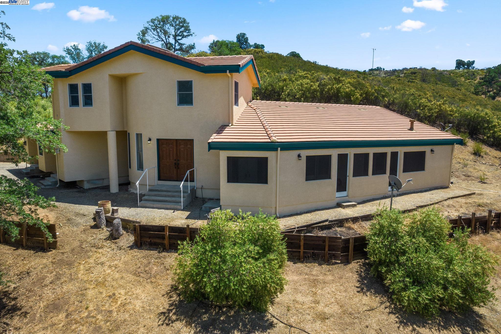 59480 Mines Road Livermore, CA 94550 - Photo 5 of 44 Front of the house with surrounding olive trees