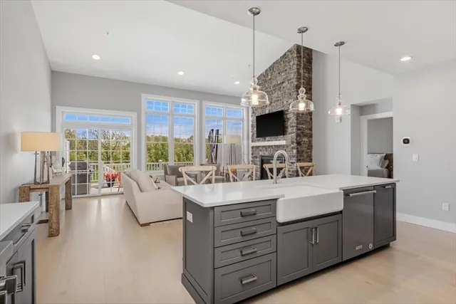 a large kitchen with a table and chairs
