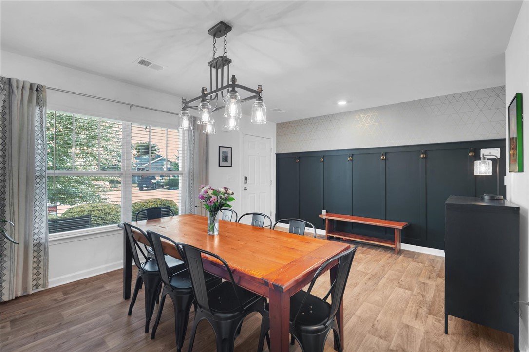 34 Karkinnen Court Pendleton, SC 29670 - Photo 7 of 36 A refined dining space with wood-look flooring and ample natural light invites gatherings.