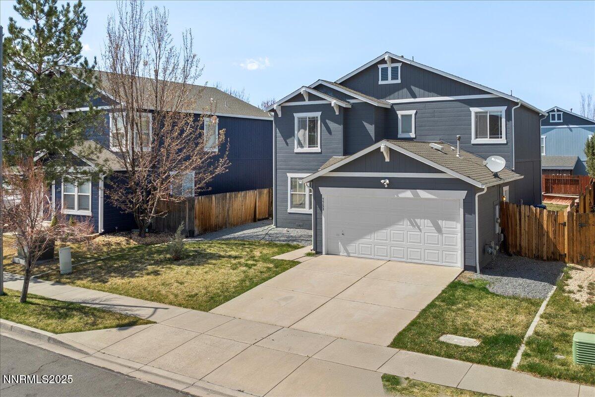7753 Tulear Street Reno, NV 89506 - Photo 1 of 38 a front view of a house with garden