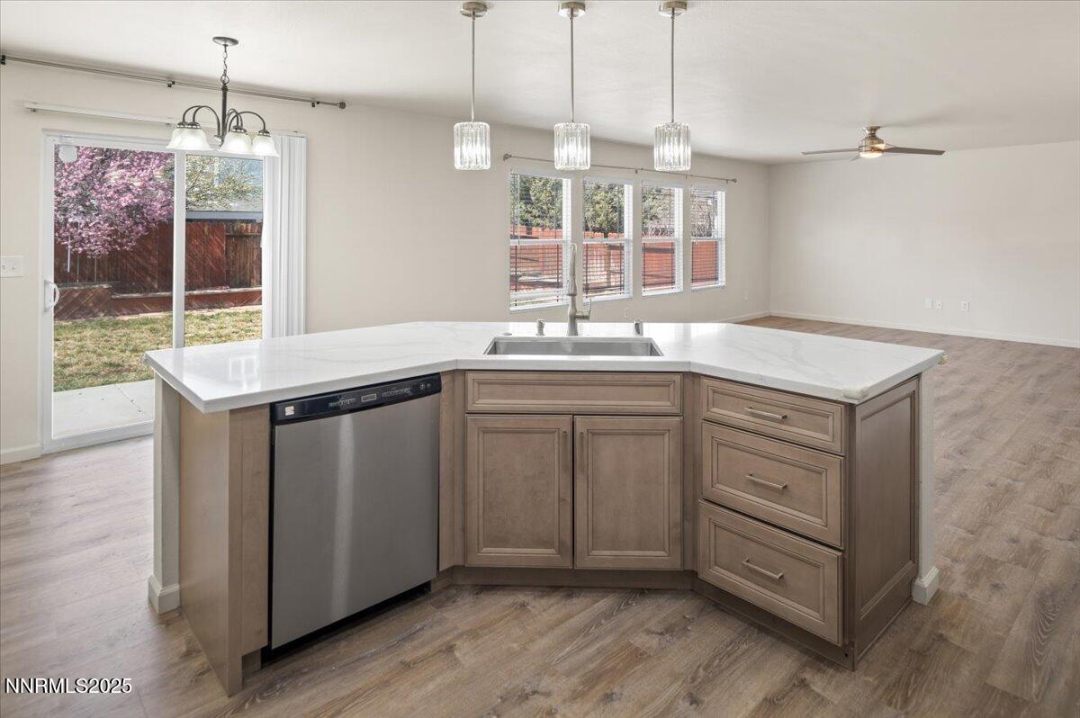 7753 Tulear Street Reno, NV 89506 - Photo 14 of 38 a kitchen with a sink stove and window